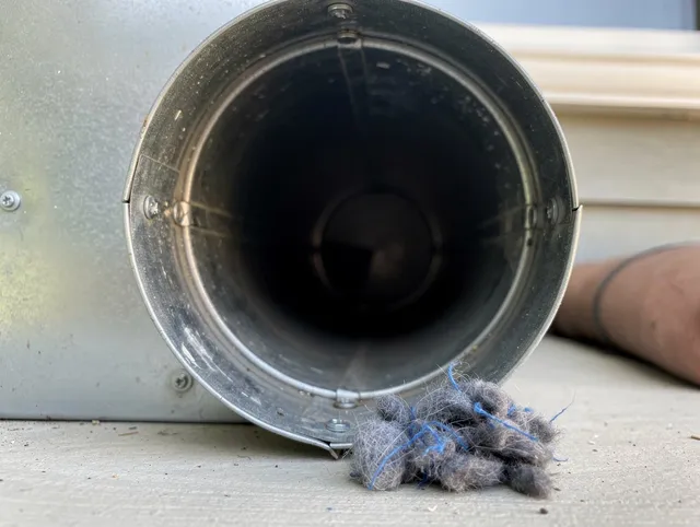 Lakeland Dryer Vent Cleaning technician using specialized equipment to clear severe dryer vent blockage in Lakeland